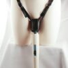 forced orgasm harness holding magic wand vibrator on maniquin