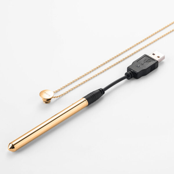 gold vibrator attached to charge and necklace chain
